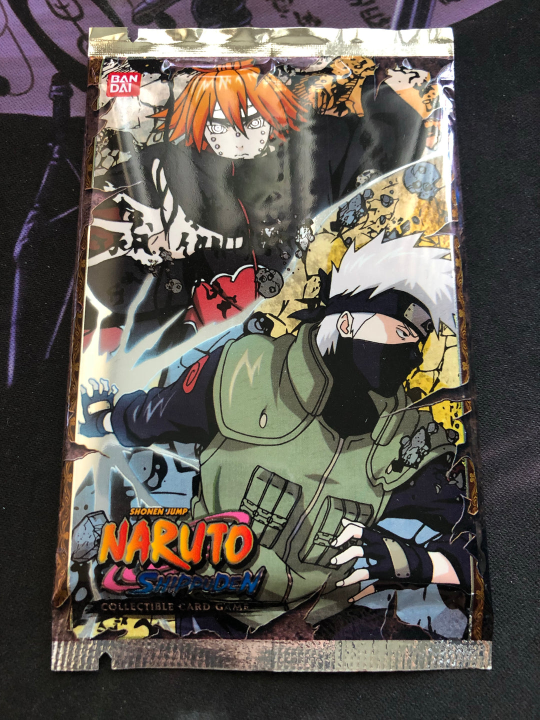 Snag A Piece Of The Nostalgia With This Factory Sealed X1 Naruto CCG Booster Pack From The Approaching Wind Set. Perfect For A Collector Looking To Rip Some Packs Or Keep That Blister Pack Sealed For The Long Haul.